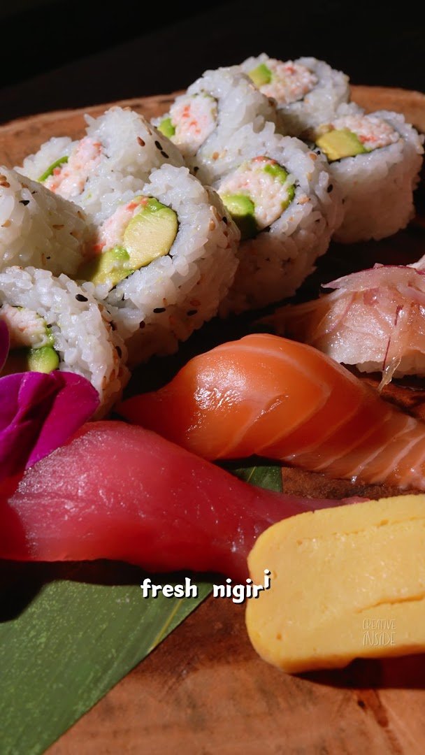 Fresh sashimi and rolls served together.