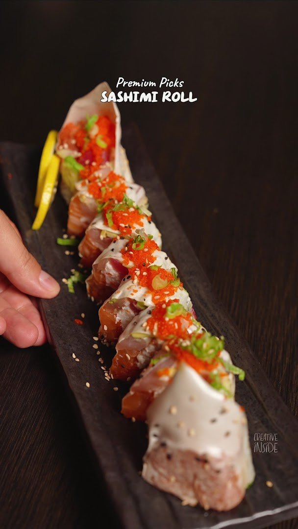 Sushi rolls arranged on a restaurant plate.